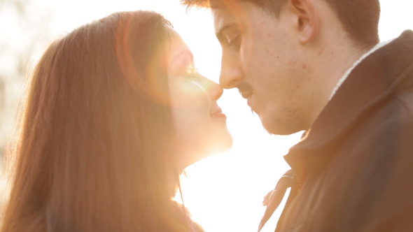 Sun's Rays Through Silhouette Of Couple alt