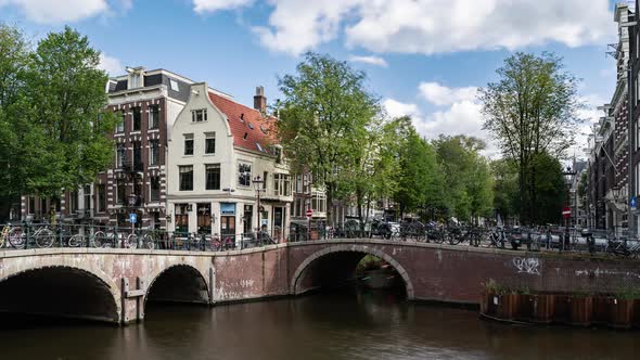 Amsterdam, Netherlands, Timelapse - Amsterdam city buildings timelapse at canal waterfront alt