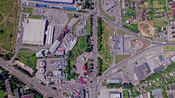 Drone Aerial View of Crossroad in Modern City in Rush Hour alt