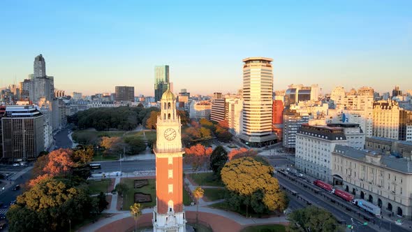 Iconic Torre Monumental in Buenos Aires stands proud in early morning sun; drone alt