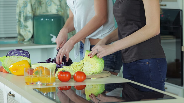 Two Smiling Girlfriends Sliced Vegetables alt