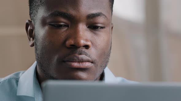 Serious Male Young African American Businessman Programmer Typing on Computer at Home Office Focused alt