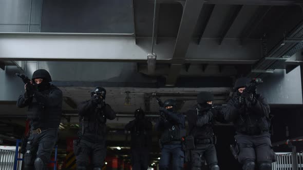 SWAT Team Members Exploring Building alt