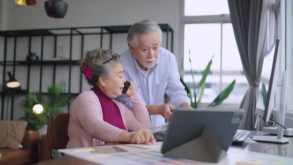 old senior asian retired people entrepreneur working together at home