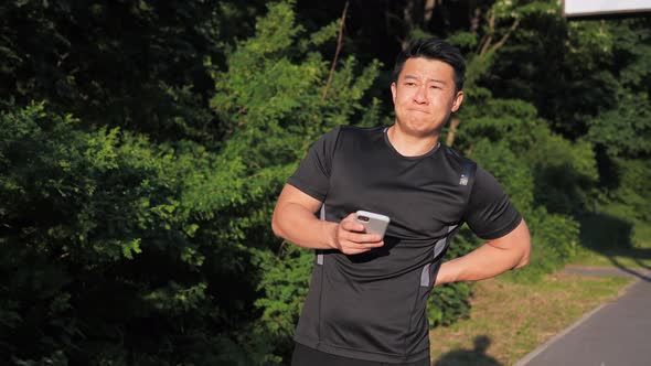 Young Asian Sportsman Have Shoulder Pain Injury After Running at Sunset alt