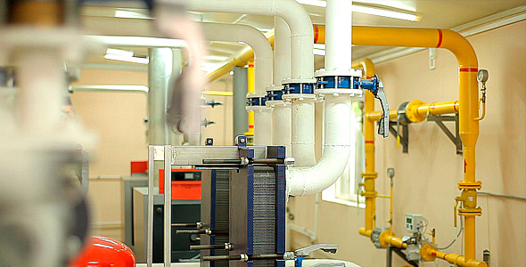 Pipes and Meters in the Boiler Room in the Plant alt