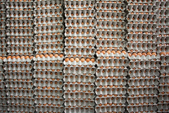Stacks of brown eggs background