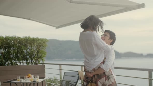 Happy Couple Spinning Around Outdoor on Terrace Rbbro alt