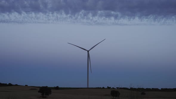 Single Isolated Windmill Turbine at Sunset with Text Space