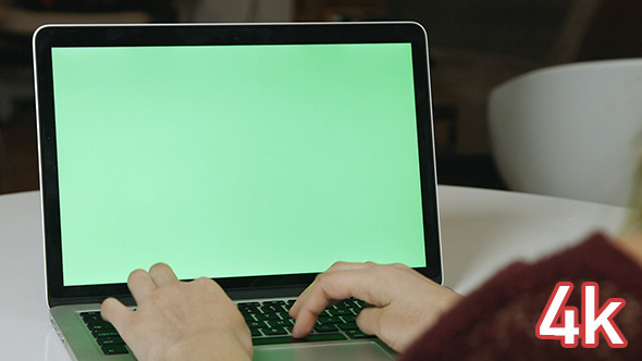Girl Typing on Laptop with Green Screen