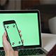 Holding Phone with Laptop Green Screen - VideoHive Item for Sale