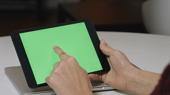 Girl Using Tablet with Green Screen