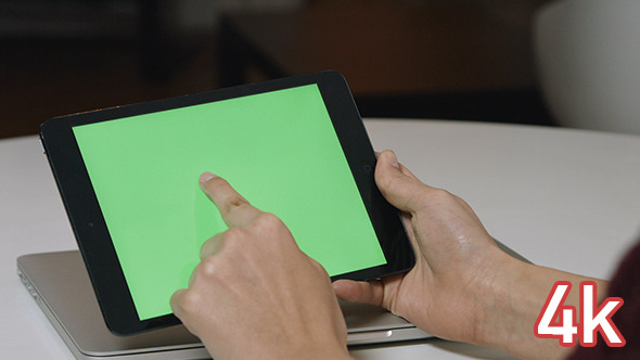 Girl Using Tablet with Green Screen