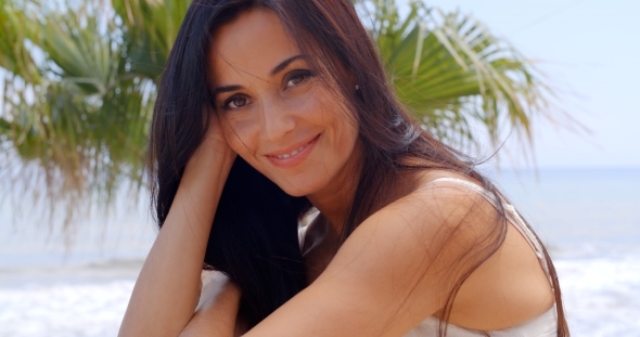 Cheerful Woman At The Beach Looking At The Camera alt
