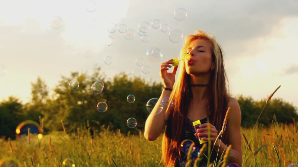 Woman Is Blowing Bubbles