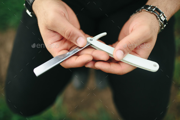 ancient blade in the hands of men
