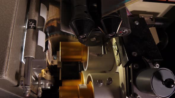 Film Runs Through a 35Mm Projector in a Movie Theater alt