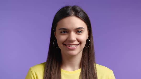 Young Closeup Woman with Long Hair Looking to Camera Smiling alt