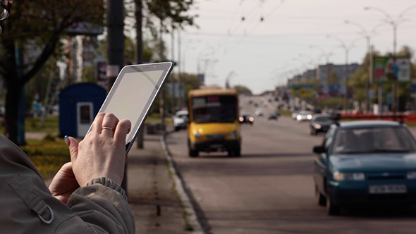 Girl Using a Touchpad on The Street