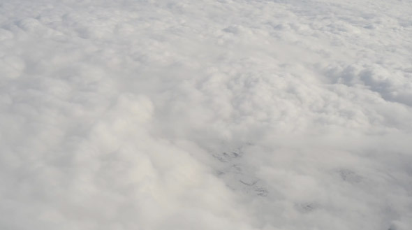Aerial View from Airplane - White Clouds