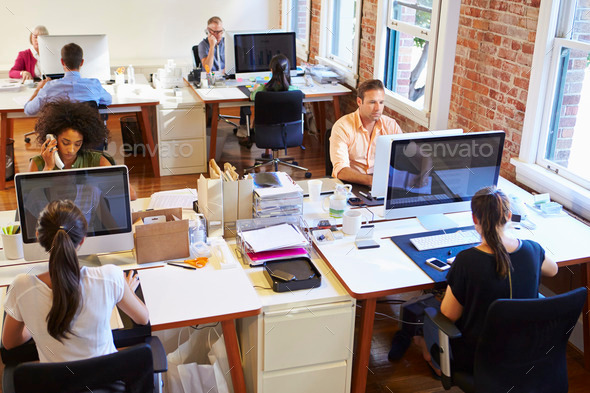 Wide Angle View Of Busy Design Office With Workers At Desks - Stock Photo - Images