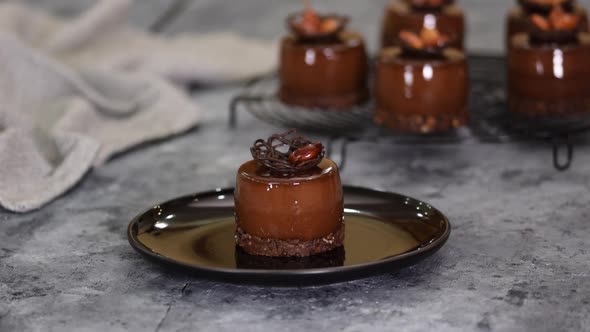 Pastry Chef Decorate a Chocolate Mousse Dessert with Caramel Almond