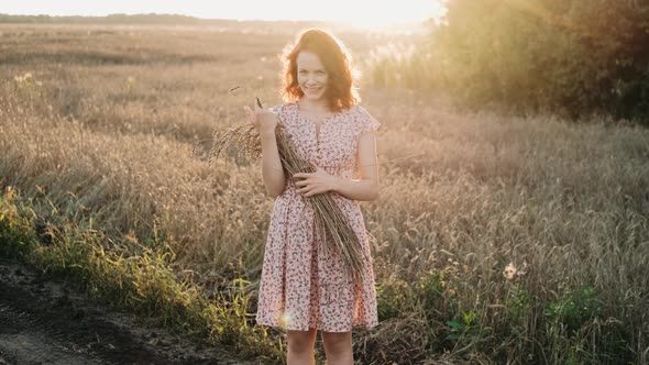 Portrait of a Beautiful Redhead Girl at Sunset alt