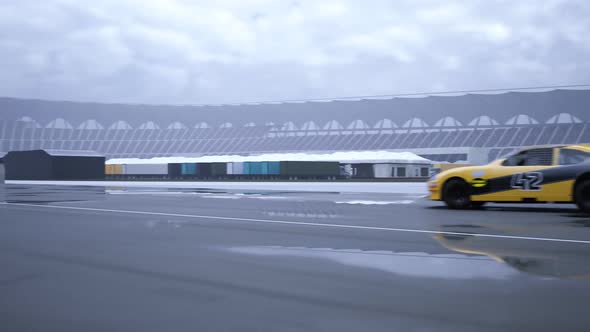 High speed racing car driving and drifting without smoke around racing track. alt