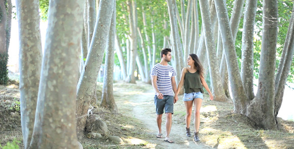 Couple Walking In The Forest