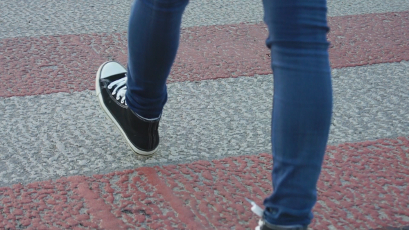 Girl Crossing the Road