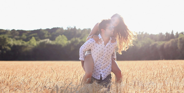 Couple Across The Wheat Field
