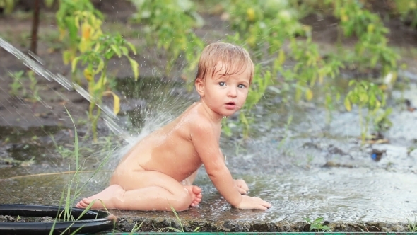 Child Sprinkled With Water