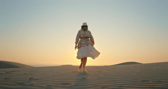 Woman Running Toward the Sunset By Scenic Desert Nature Landscape  Slow Motion alt