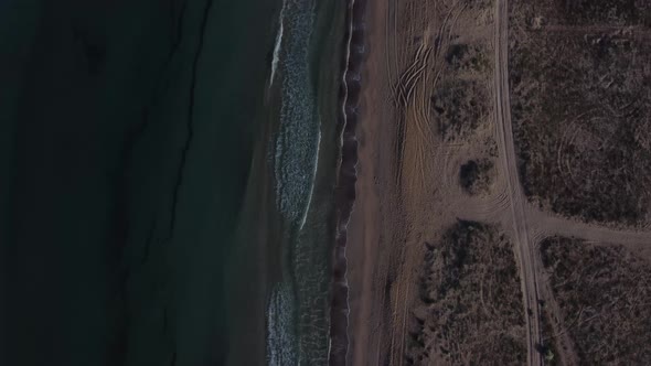 Sea Waves Flowing Ashore in Windy Weather Shooting From the Height of the Drone