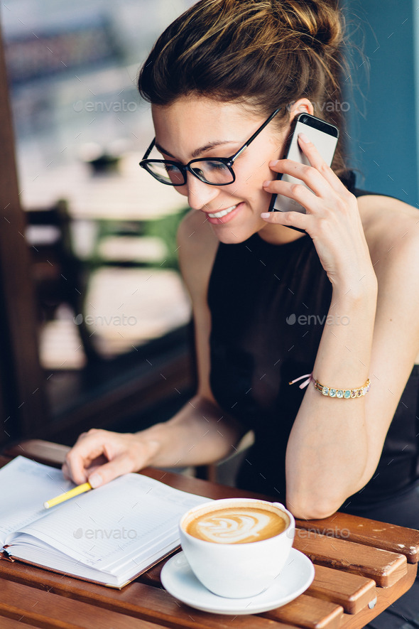 Attractive girl talking on the phone - Stock Photo - Images