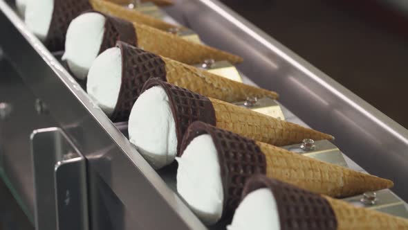 Ice Cream Production, Transportation Waffle-cone with Plombir Ice Cream on Conveyor, Production Line alt