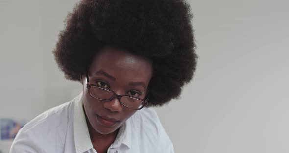 Busy Hard Working Professional AfroAmerican Woman Doctor Consulting Customers In alt