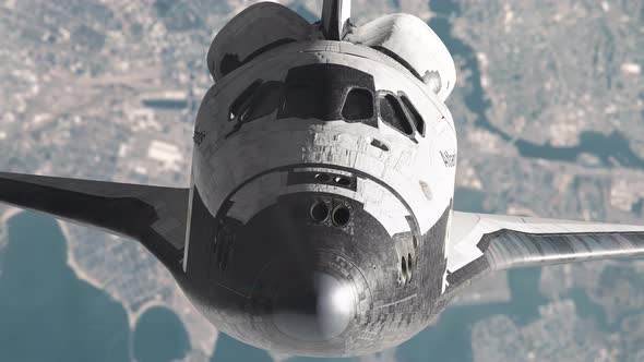 Space Shuttle in Orbit Above the Earth