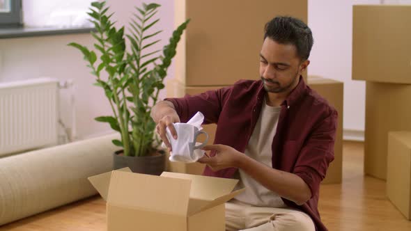 Indian Man Packing Boxes and Moving To New Home 31 alt