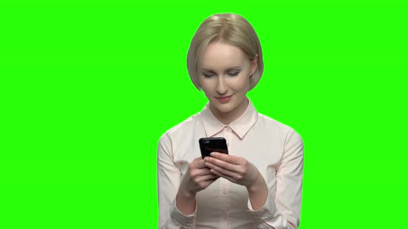 Portrait of Beautiful Blonde Woman Using Her Phone alt