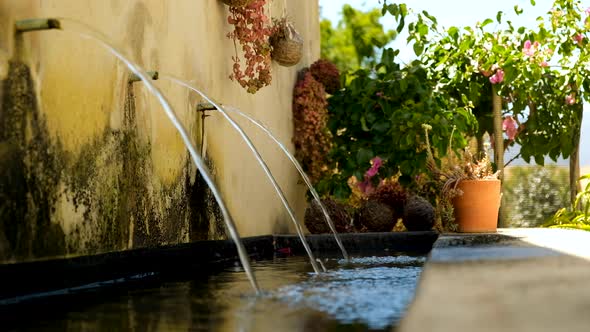 Three water streams cascading into pond, relaxing meditation scene alt