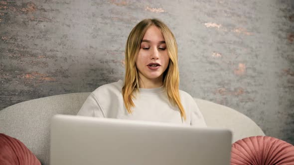 Dolly Out Young Woman Talking To Colleagues Via Laptop During Web Conference Live Streaming From alt