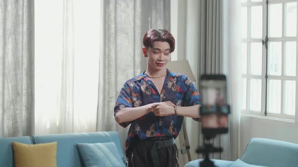 Asian Transgender Male Dancing While Shooting Video Content For Social Networks With A Smartphone alt