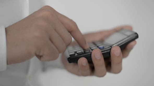 Businessman Using Calculator alt