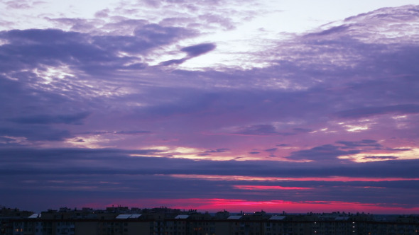 Evening Sky over the Roofs of the City alt