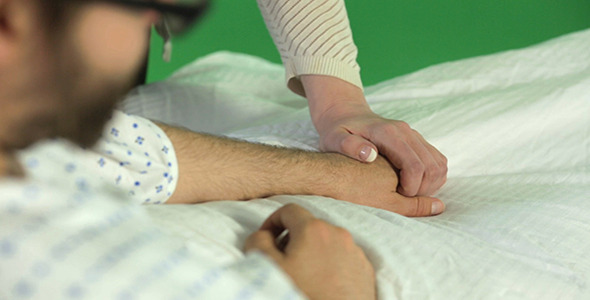 Hospital Patient Getting His Hand Held