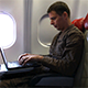 Man Working on Laptop on an Airplane and Going to  - VideoHive Item for Sale