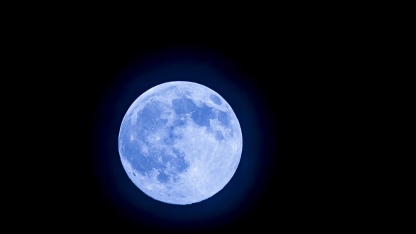Big Blue Full Moon Rising In The Sky