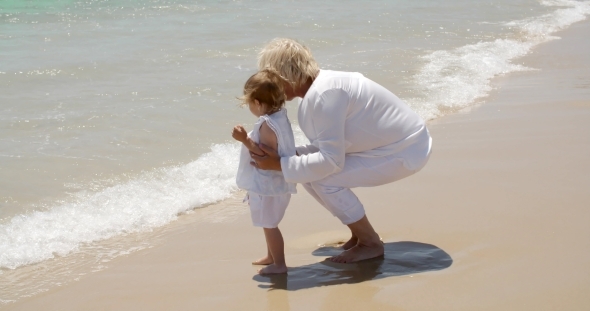 Grandma And Little Girl Having Fun At The Beach alt