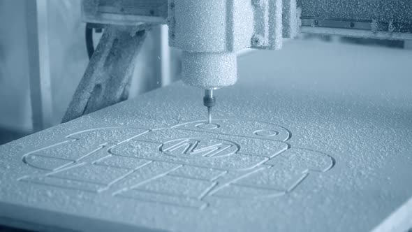 Milling Machine Carves the Form on a White Surface Closeup alt